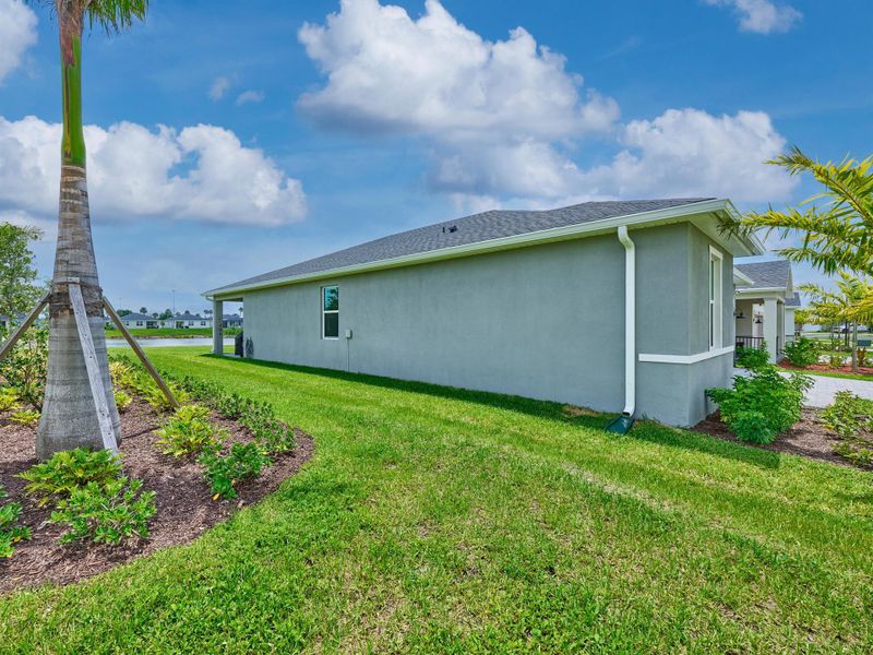 Front exterior of a new home in Azalea, Port St. Lucie, FL, highlighting curb appeal (Image 25).
