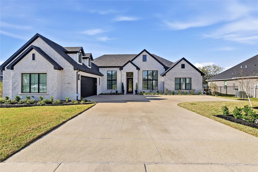 Front exterior of a new home in , Bryan, TX, highlighting curb appeal (Image 2).