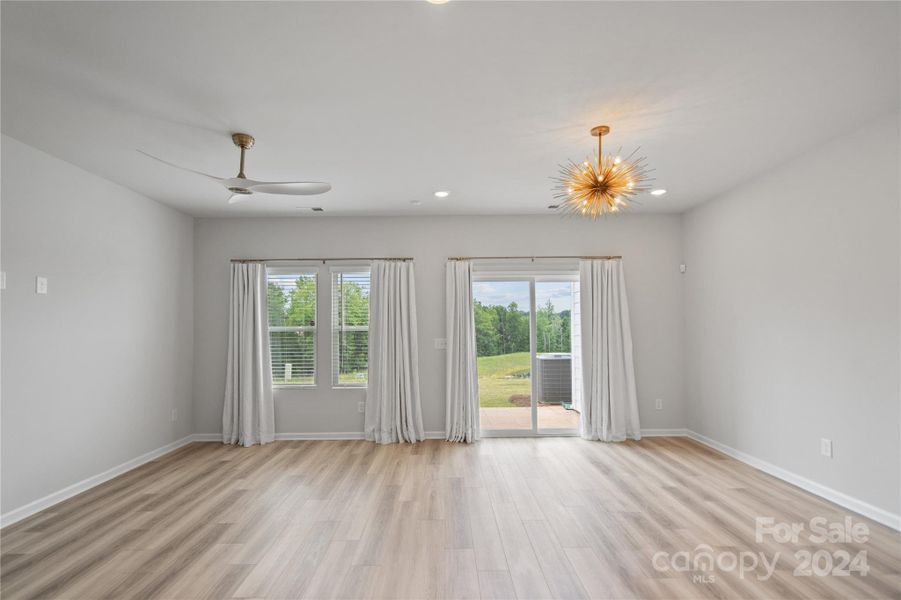 open living & dining area with doors to patio and rear yeard