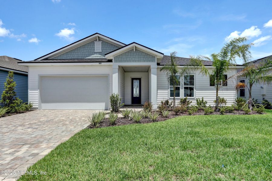 Front exterior of a new home in Reverie at Silverleaf, St. Augustine, FL, highlighting curb appeal (Image 2).