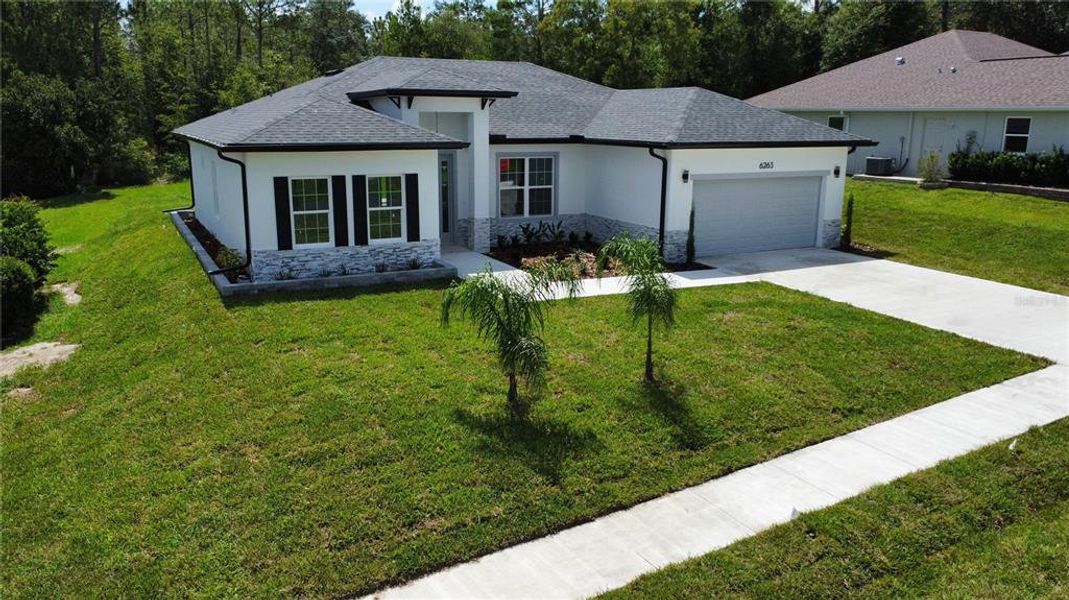 Front exterior of a new home in , Beverly Hills, FL, highlighting curb appeal (Image 29).