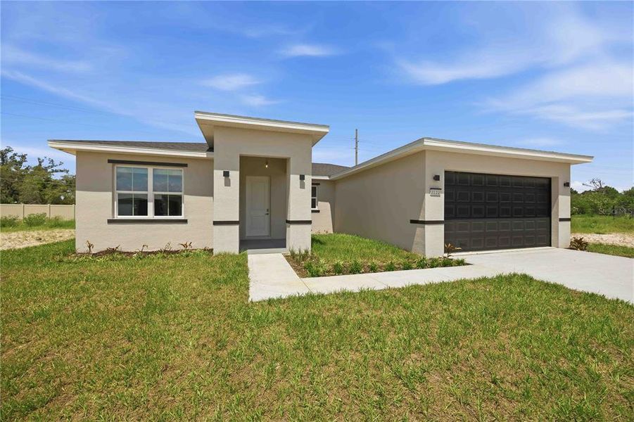 Front exterior of a new home in , Winter Haven, FL, highlighting curb appeal (Image 21).