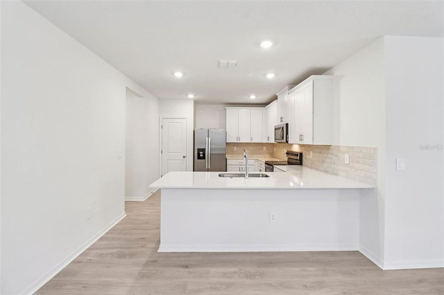 Furnished interior view inside a new home in Ridgehaven - Villas, Ormond Beach (Image 5).