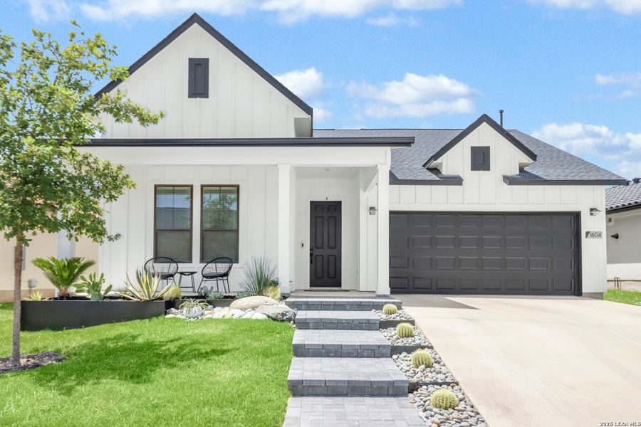 Front exterior of a new home in Kissing Tree, San Marcos, TX, highlighting curb appeal (Image 21).