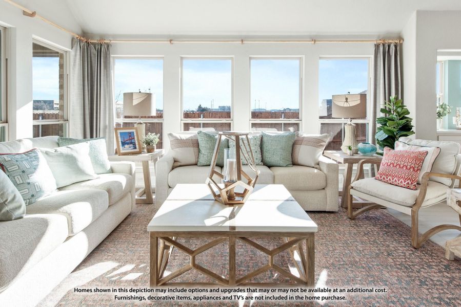 Bright living room with neutral sofas, wood coffee table, and large windows with outdoor views. Bright living room with neutral sofas, wood coffee table, and large windows with outdoor views.
