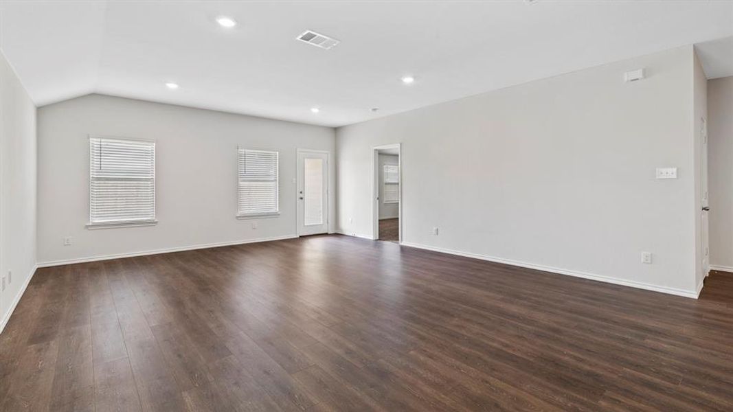 Spare room with recessed lighting and dark wood-style flooring