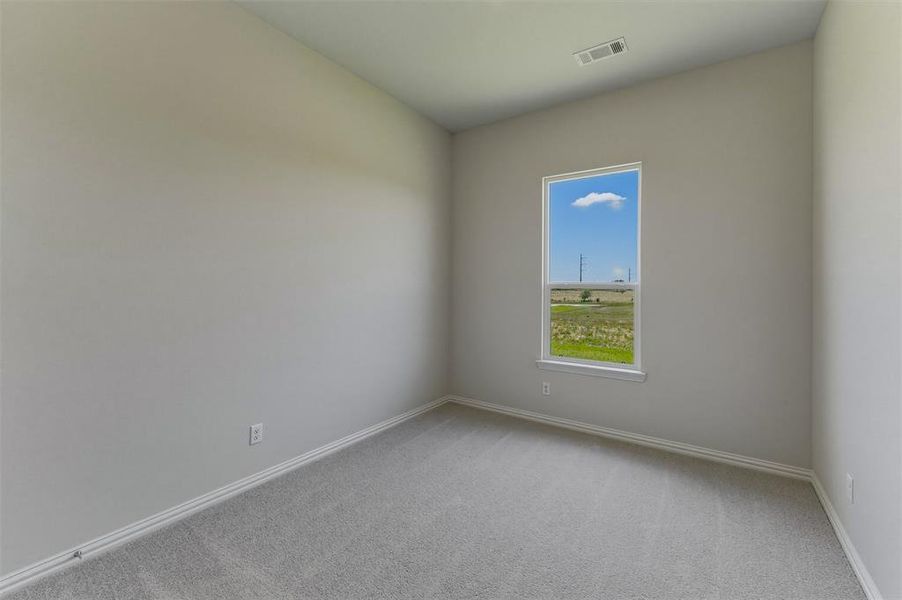 Room featuring light gray carpet, neutral wall paint, and white baseboards