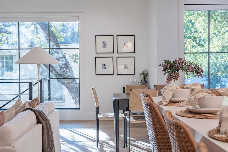 Dining space with wood-type flooring