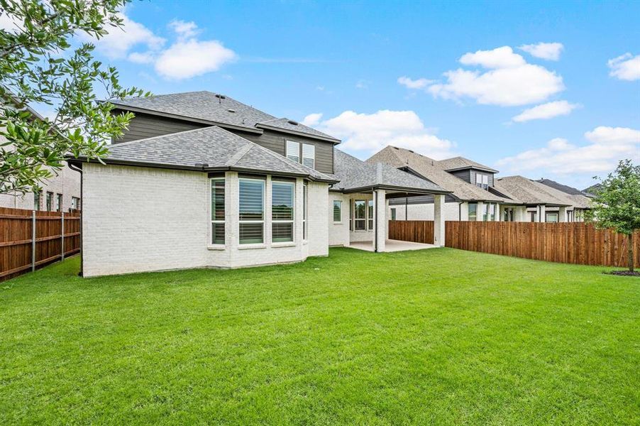 Exterior details and patio area of a home in Wildflower Ranch, Fort Worth (Image 3).