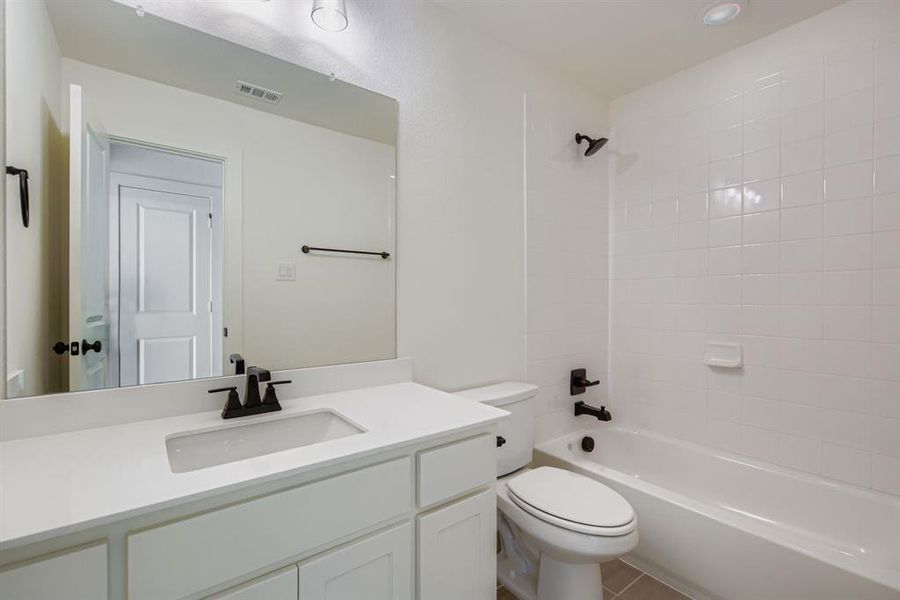 Bathroom featuring bathing tub / shower combination and vanity
