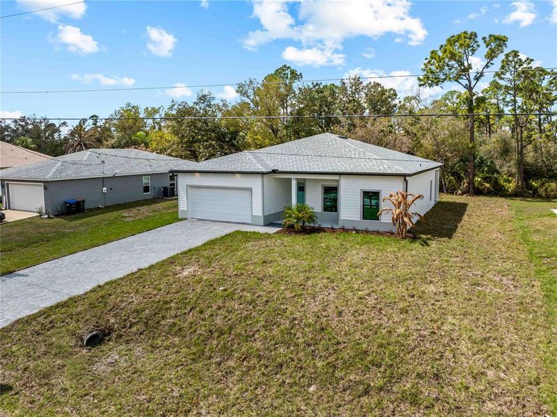 Front exterior of a new home in , North Port, FL, highlighting curb appeal (Image 29).