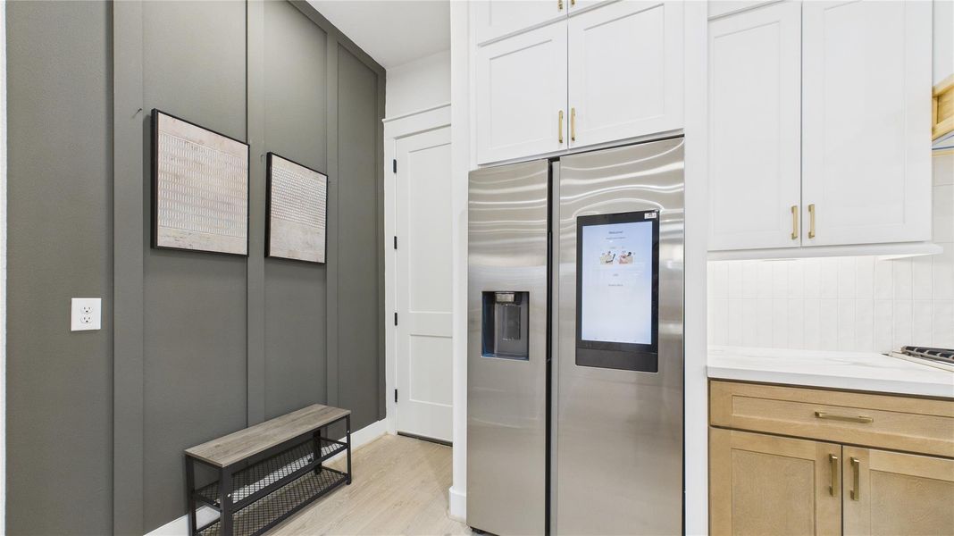 Entry from the garage with room for shoe cabinet and hanging cloths