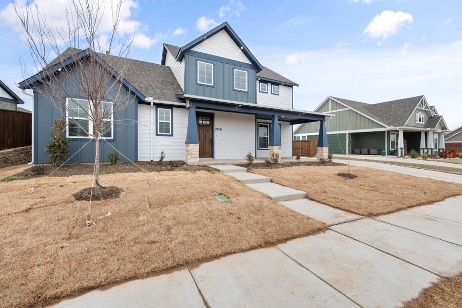 Front exterior of a new home in Heritage Towne, Midlothian, TX, highlighting curb appeal (Image 27). Front exterior of a new home in Heritage Towne, Midlothian, TX, highlighting curb appeal (Image 27).