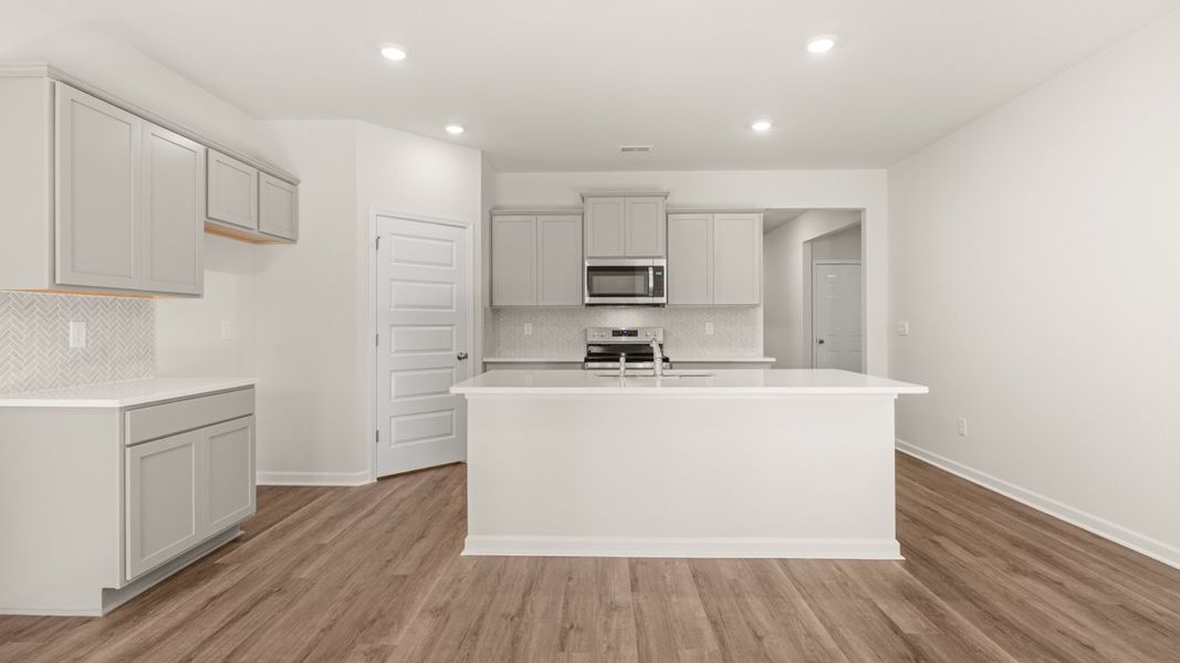 Representative furnished interior of a home built from the CALI Express by D.R. Horton in Teamon Pointe, Griffin (Image 6).