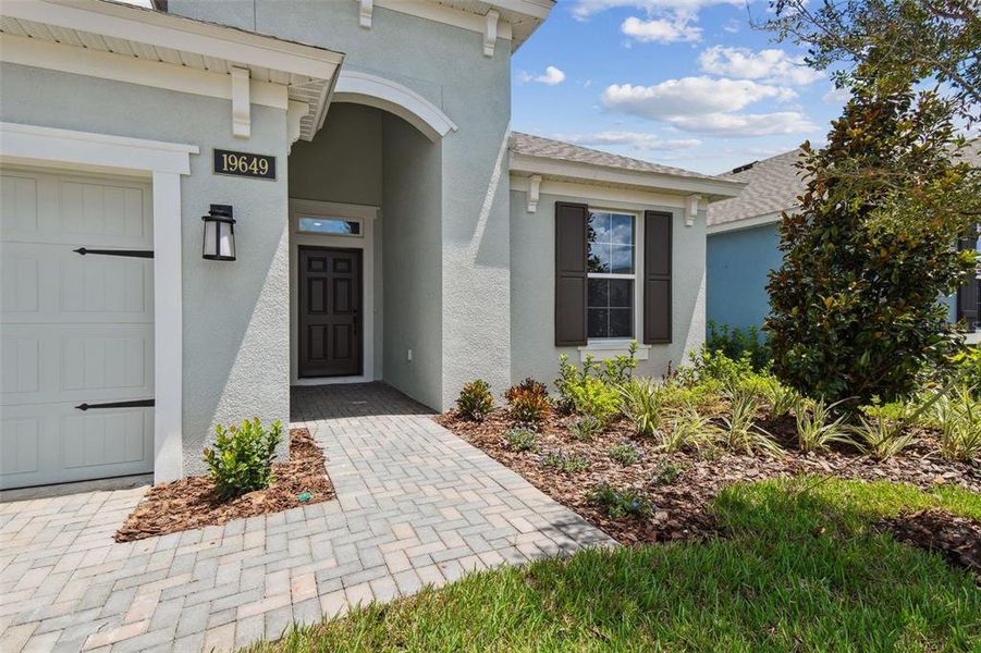 Front exterior of a new home in Cascades at Southern Hills, Brooksville, FL, highlighting curb appeal (Image 2).