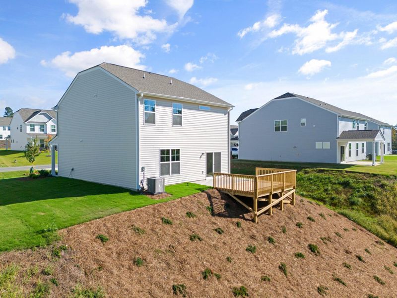 Front exterior of a new home in Cottages at Piper Village, Trinity, NC, highlighting curb appeal (Image 22).