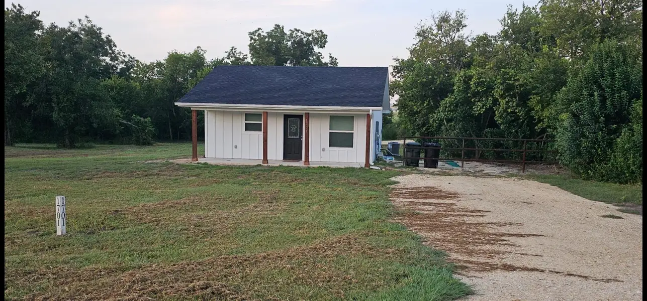 View of house from the first entrance. Tree lined for privacy. View of house from the first entrance. Tree lined for privacy.