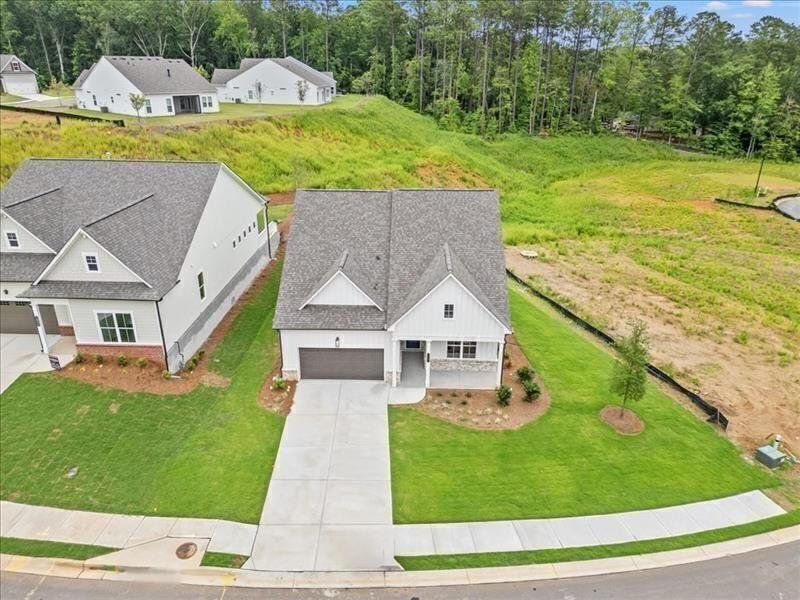 Front exterior of a new home in Cooks Farm, Woodstock, GA, highlighting curb appeal (Image 40). Front exterior of a new home in Cooks Farm, Woodstock, GA, highlighting curb appeal (Image 40).