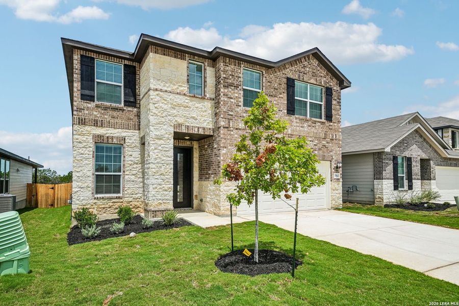 Front exterior of a new home in Thomas Pond, San Antonio, TX, highlighting curb appeal (Image 28). Front exterior of a new home in Thomas Pond, San Antonio, TX, highlighting curb appeal (Image 28).