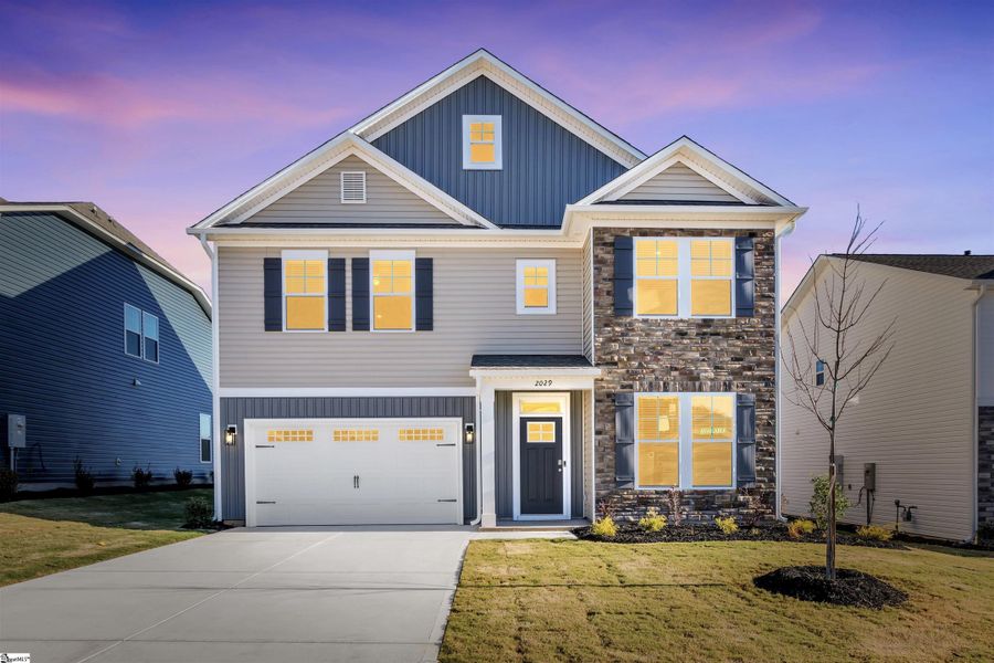Front exterior of a new home in Halton Oaks, Spartanburg, SC, highlighting curb appeal (Image 1).