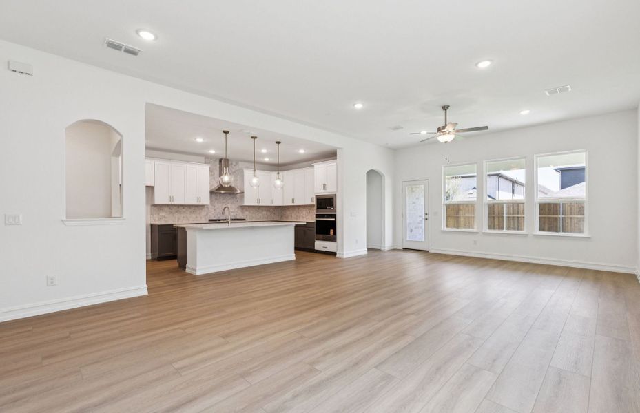 Open concept gathering room creating a spacious and inviting atmosphere  *Real home pictured