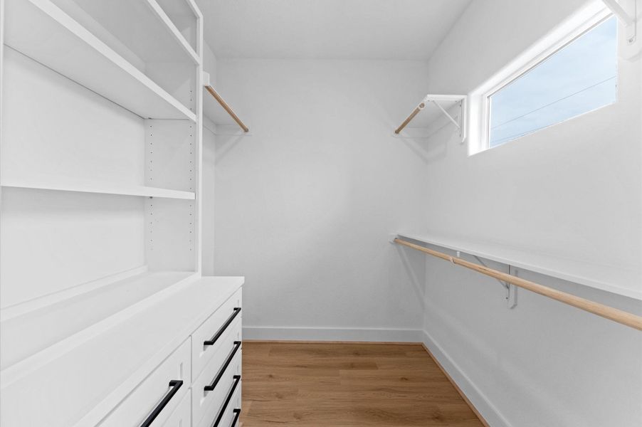 Everyone loves a walk-in closet and this one doesn't disappoint! Enjoy plenty of space for hanging clothes, folded clothes, shoes, and bags.