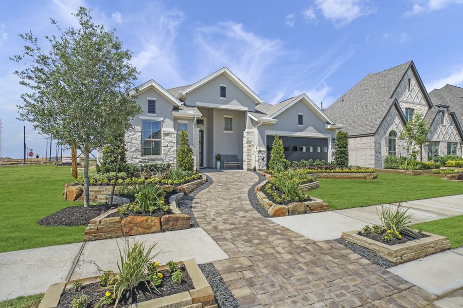 Front exterior of a new home in Jordan Ranch, Fulshear, TX, highlighting curb appeal (Image 22).