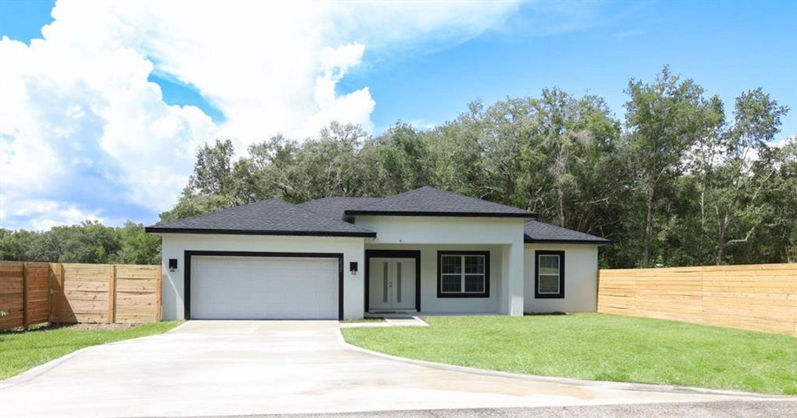 Front exterior of a new home in , Dunnellon, FL, highlighting curb appeal (Image 21). Front exterior of a new home in , Dunnellon, FL, highlighting curb appeal (Image 21).