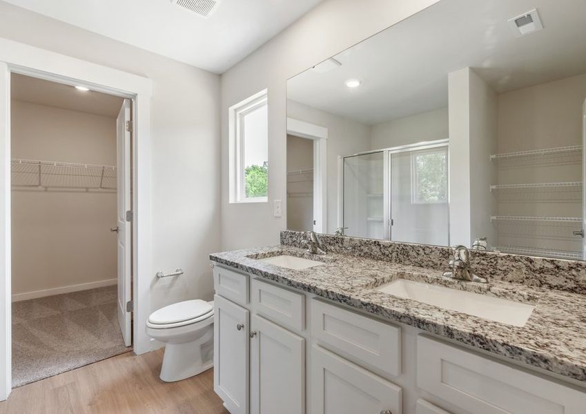 The master bathroom has a glass-enclosed shower The master bathroom has a glass-enclosed shower