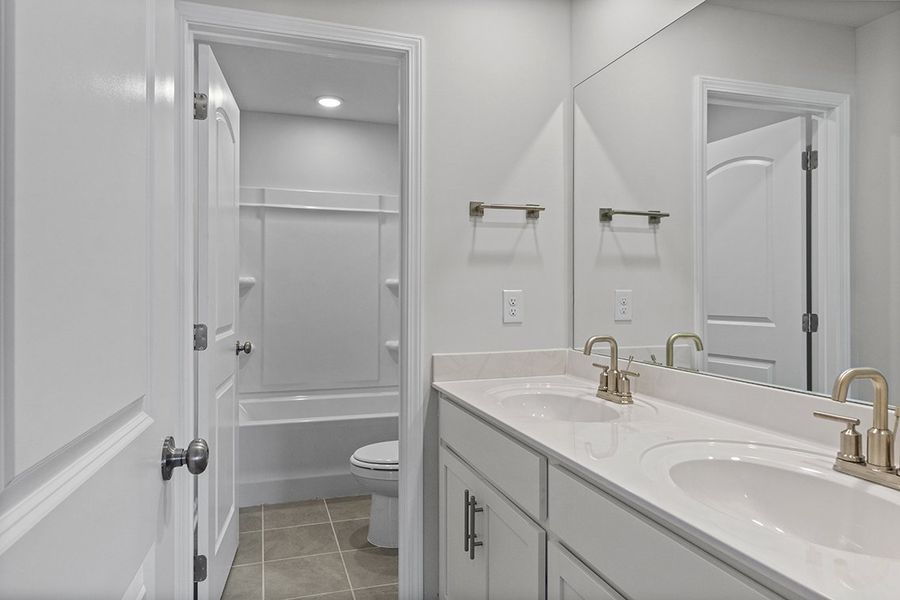 A bathroom with a glass shower. A bathroom with a glass shower.