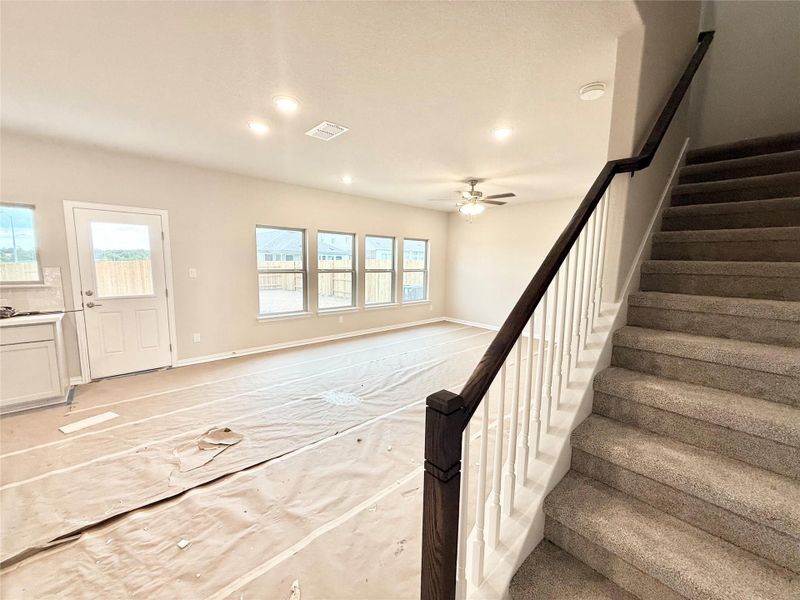 Stairway featuring recessed lighting and ceiling fan Stairway featuring recessed lighting and ceiling fan