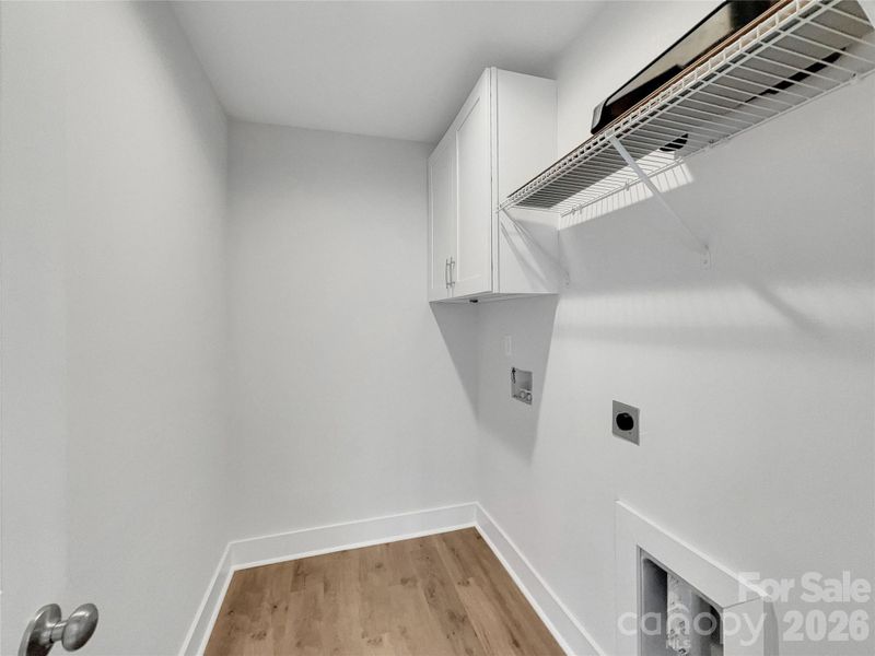 Laundry Room with cabinets and shelves Laundry Room with cabinets and shelves