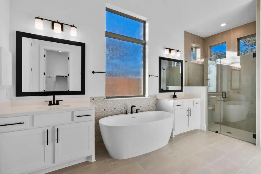 Primary Bath retreat with dual vanities, soaking tub & walk-in shower