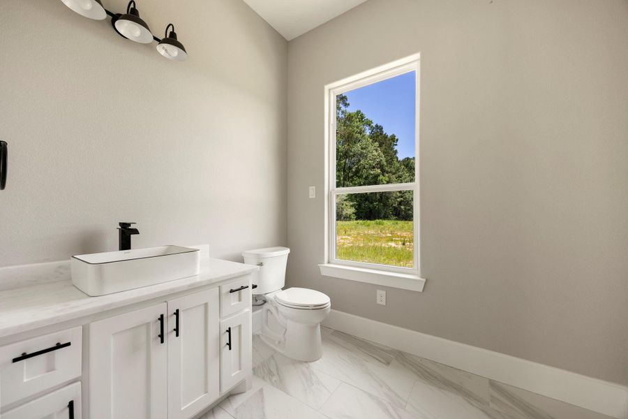 Furnished interior view inside a new home in , New Waverly (Image 38).