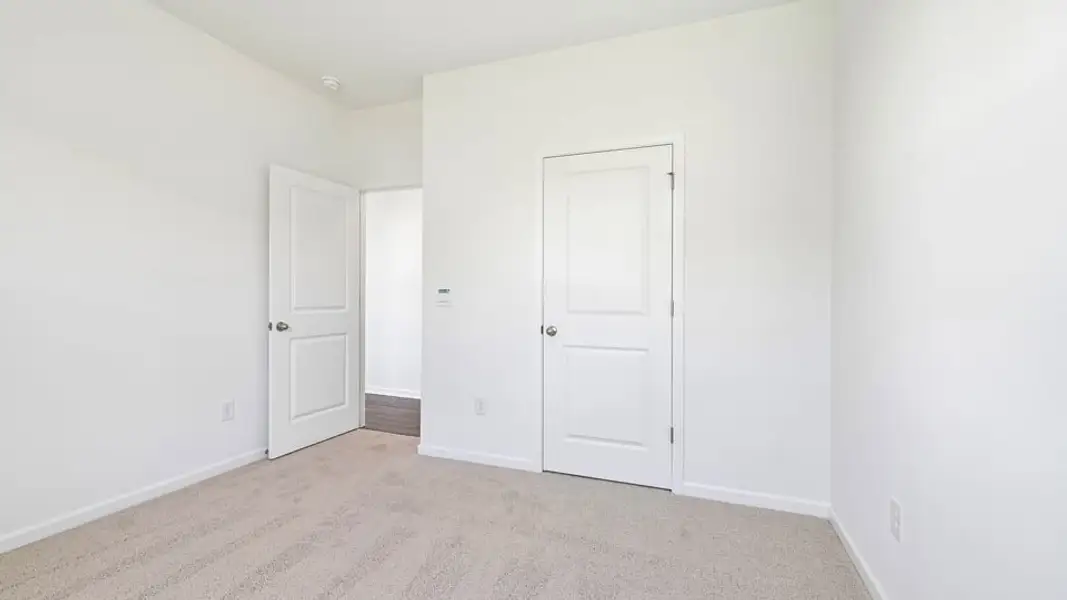 Spacious, unfurnished interior of a new home in Shahbain Reserve, Raeford (Image 30). Spacious, unfurnished interior of a new home in Shahbain Reserve, Raeford (Image 30).
