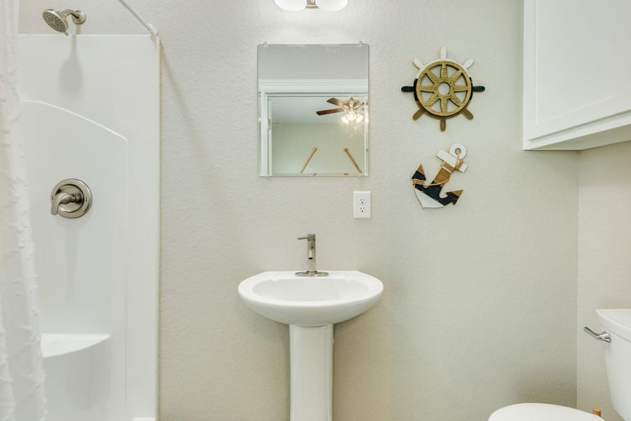 Bath with shower an pedestal sink Bath with shower an pedestal sink