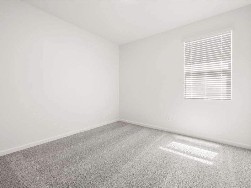 Spacious, unfurnished interior of a new home in Blossom Rock Reserve Series, Apache Junction (Image 11).