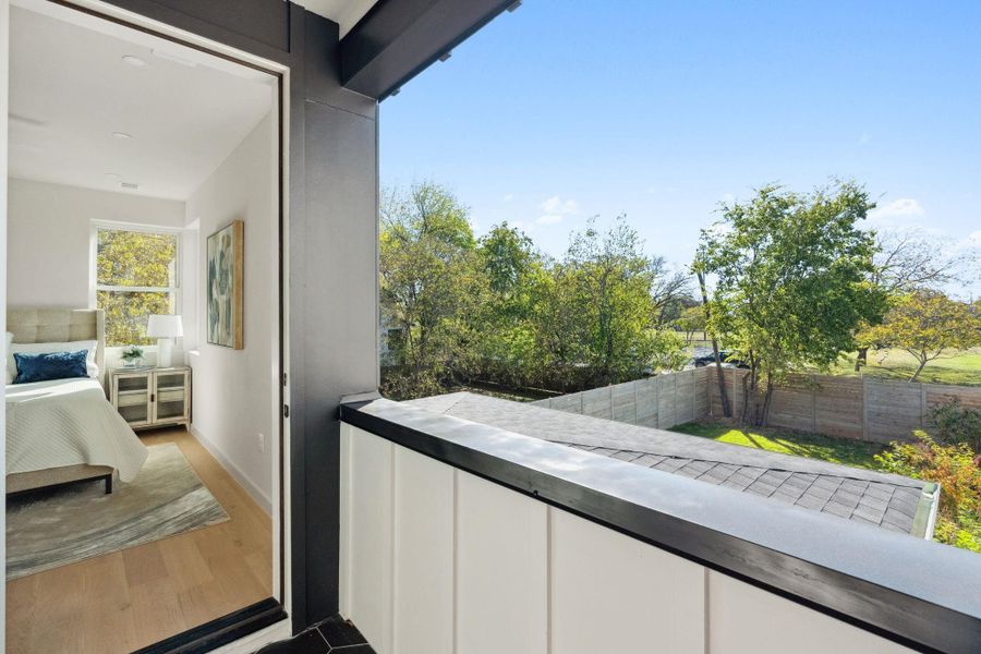 covered balcony with views to the field behind