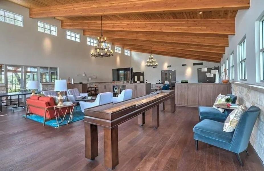 Rec room with suspended lighting, dark wood-style flooring, and a high wood beamed ceiling