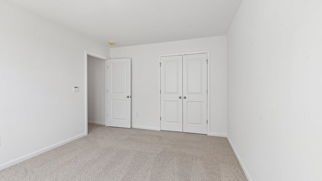 Representative unfurnished interior of a home built from the Calhoun by D.R. Horton in Collins Ridge, Hillsborough (Image 28).