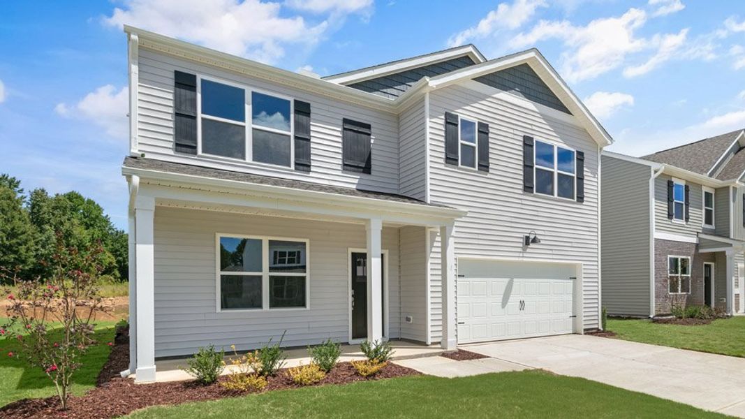 Front exterior of a new home in Tyler - Home on the Lake, New Bern, NC, highlighting curb appeal (Image 2). Front exterior of a new home in Tyler - Home on the Lake, New Bern, NC, highlighting curb appeal (Image 2).