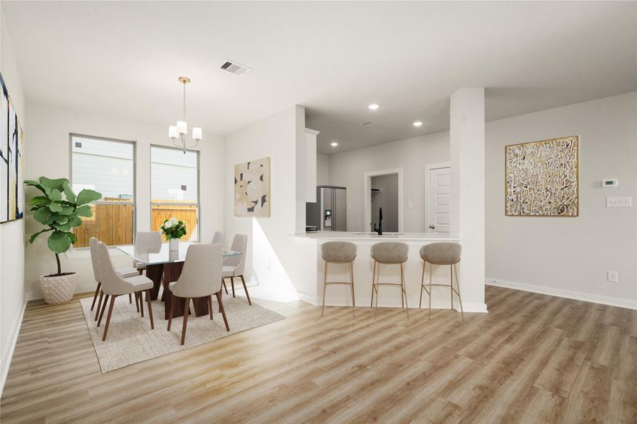 This bright and airy space showcases a beautiful open layout with an effortless flow between the dining area and kitchen. Large windows invite abundant natural light, highlighting the soft neutral palette and modern finishes throughout. The kitchen features sleek cabinetry, a spacious island with bar seating, and contemporary lighting that adds a touch of sophistication. Perfectly designed for both daily living and casual gatherings, this space embodies comfort, style, and functionality. This bright and airy space showcases a beautiful open layout with an effortless flow between the dining area and kitchen. Large windows invite abundant natural light, highlighting the soft neutral palette and modern finishes throughout. The kitchen features sleek cabinetry, a spacious island with bar seating, and contemporary lighting that adds a touch of sophistication. Perfectly designed for both daily living and casual gatherings, this space embodies comfort, style, and functionality.