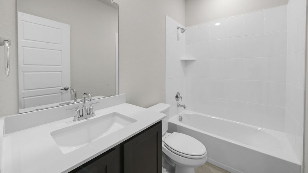 Representative furnished interior of a home built from the Tangerine by D.R. Horton in Bel Air Village, Sherman (Image 8).