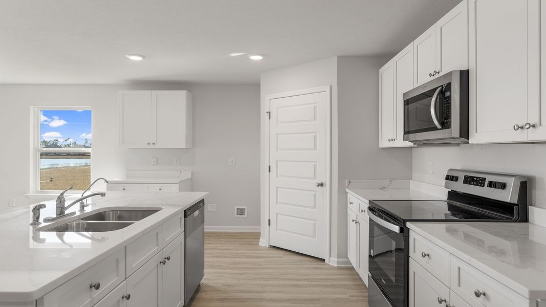 Furnished interior view inside a new home in Sunny Hills, Chipley (Image 5).
