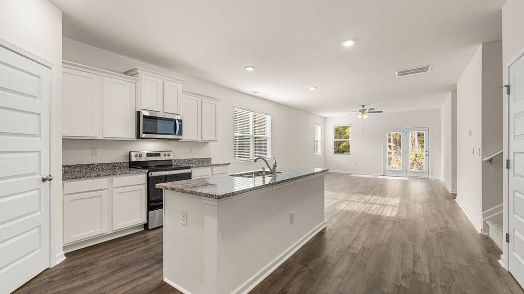 Representative furnished interior of a home built from the Dennis by D.R. Horton in Glenmaye, Hampton (Image 6).