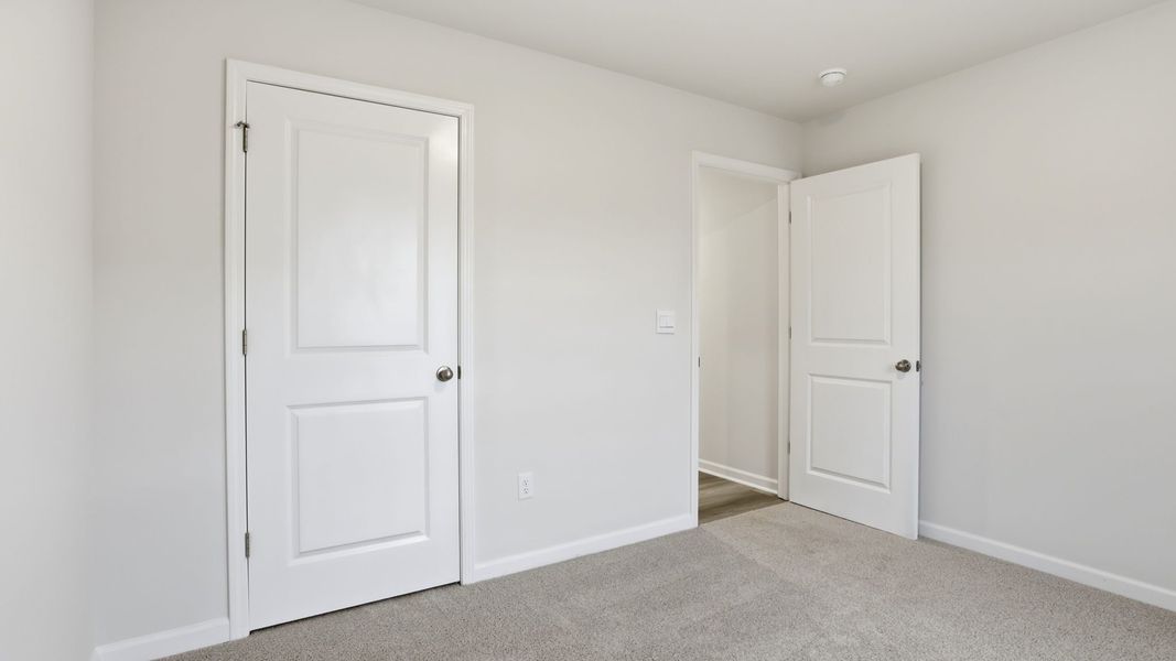 Spacious, unfurnished interior of a new home in Bentley Park, Greenwood (Image 17).