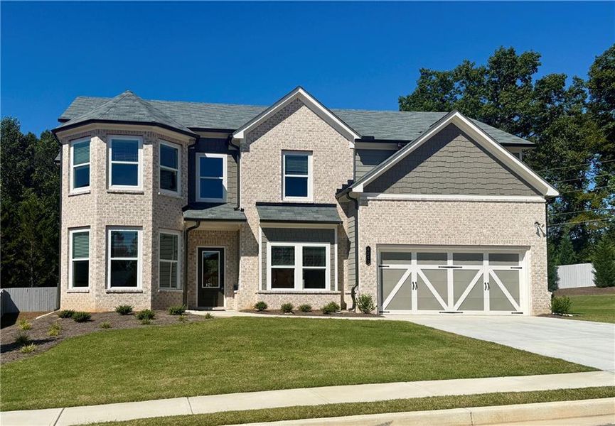Front exterior of a new home in , Hoschton, GA, highlighting curb appeal (Image 25).