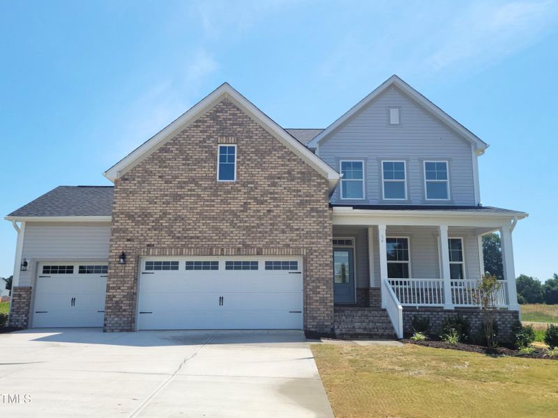 Front exterior of a new home in Tobacco Road, Angier, NC, highlighting curb appeal (Image 70). Front exterior of a new home in Tobacco Road, Angier, NC, highlighting curb appeal (Image 70).