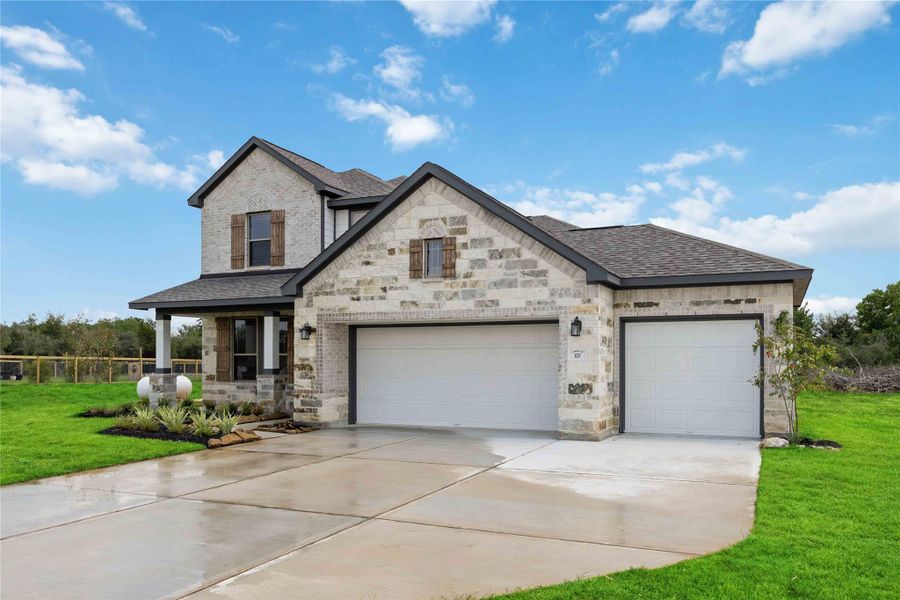 Front exterior of a new home in , Sealy, TX, highlighting curb appeal (Image 15).