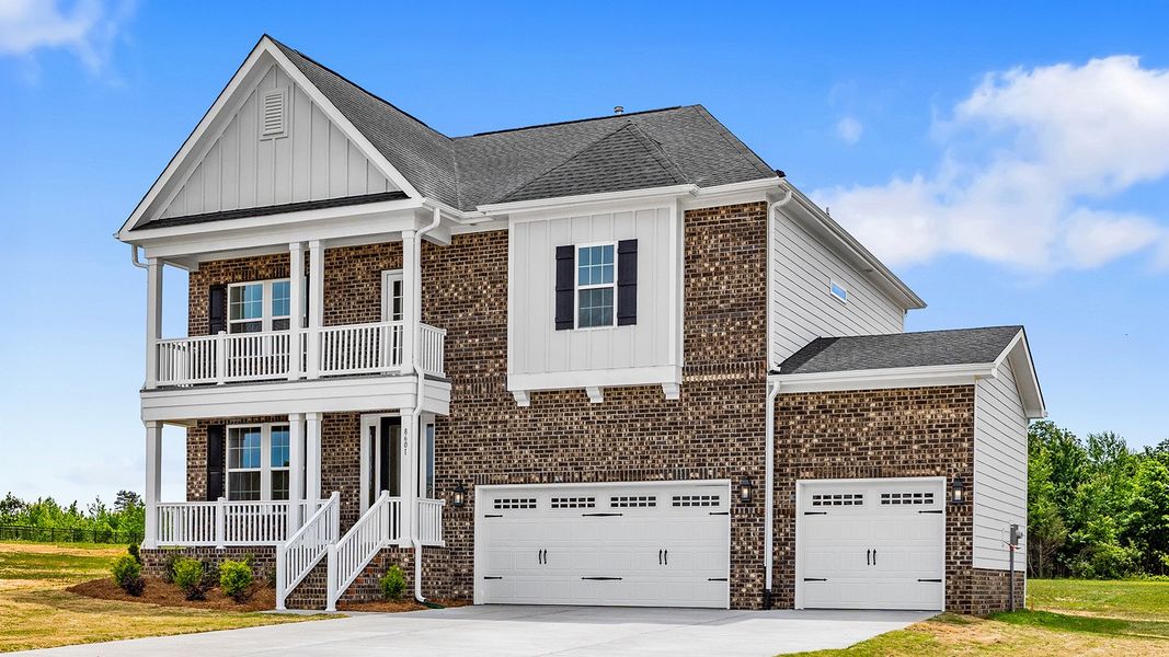 Front exterior of a new home in Lilah Grove, Summerfield, NC, highlighting curb appeal (Image 24).